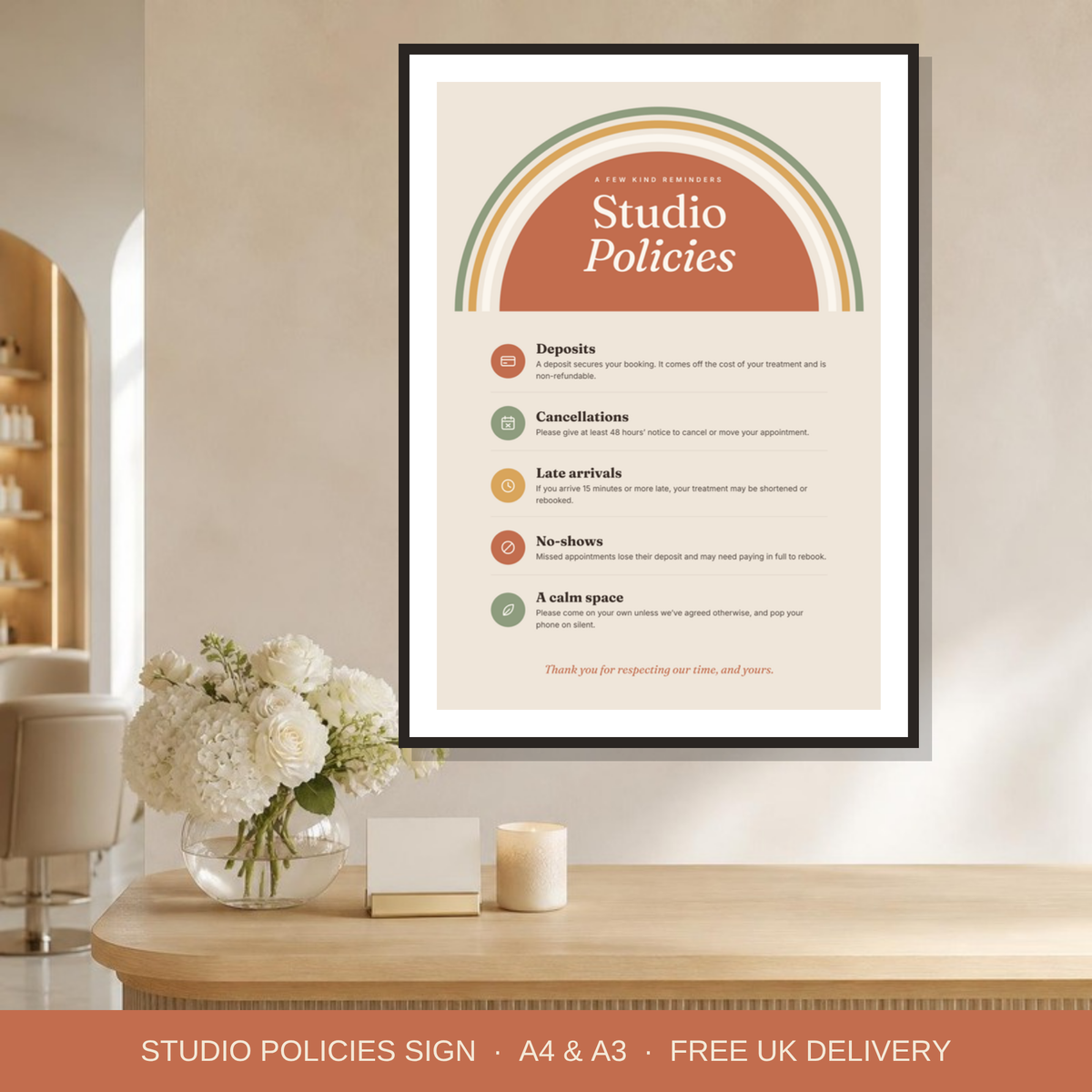 Studio policies sign framed at a salon reception